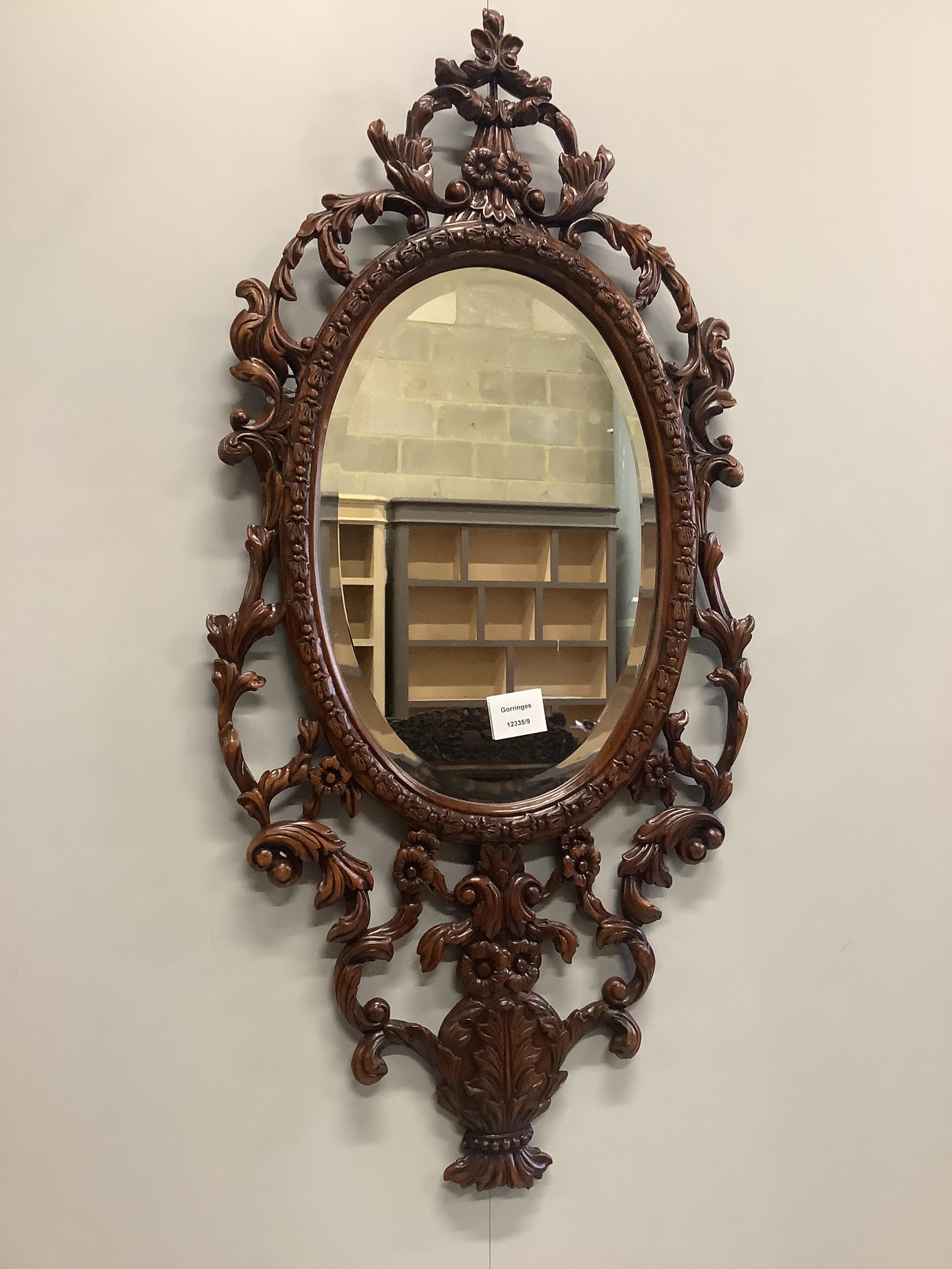 A Florentine style carved mahogany wall mirror, width 41cm, height 85cm